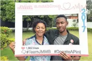  ?? CONTRIBUTE­D PHOTOS ?? Mother and son duo Teverly (left) and Tavoy Gray take the time for a photo op in support of the JMMB Group annual blood drive recently at the company’s New Kingston head office.