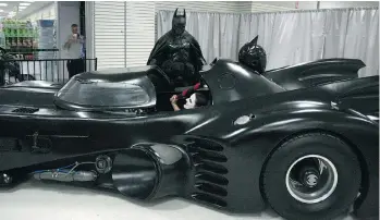  ??  ?? Stephen Lawrence, dressed as Batman, appears with his replica Batmobile during a charity appearance on Sunday in Kingston, Ont. On his ride home, he had to pull off of a busy highway to inspect a noise problem.