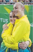  ??  ?? TEARS: Alexandra Eade (left) is embraced by Georgia-Rose Brown.