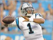  ?? File, Bob Leverone / Rome News-Tribune ?? Carolina’s Cam Newton led the Panthers to a 17-1 record before Von Miller and the Broncos stifled them in the Super Bowl.