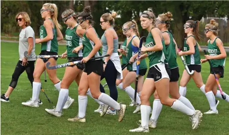  ?? CHRiS cHRiStO pHOtOS / HeRald Staff ?? BIG YEAR: The Pentucket field hockey team, led by coaches Ruth Beaton and Shannon Haley, prepare for a practice drill on Thursday. Below, Reese Gallant keeps her eye on the ball during practice.