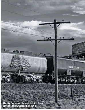  ??  ?? The ‘Big Boy’ coasts through the oil refinery town of Sinclair, Wyoming, on May 5.