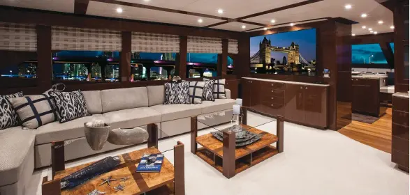  ??  ?? below: Big windows and custom-made, apartment-style furniture give this liveaboard motoryacht the feel of an upscale home.