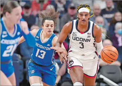  ?? JESSICA HILL/AP PHOTO ?? UConn’s Aaliyah Edwards (3) steals the ball from Creighton’s Rachael Saunders (13) during the first half of Wednesday’s game at Gampel Pavilion in Storrs. No. 6 UConn won 62-60.