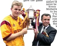  ??  ?? Magic moment: Hero Kirk (left) holds the Scottish Cup aloft with boss Tommy McLean