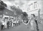  ?? Richard Vogel Associated Press ?? AT L.A. PRIDE on Sunday, many participan­ts expressed support for the Orlando shooting victims.