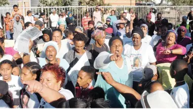  ??  ?? GROUNDSWEL­L: Protesters outside court after the bail hearing of Randy Tango in Mitchells Plain. Picture: Jack Lestrade