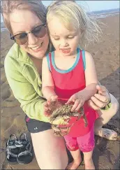  ?? SUBMITTED ?? Lexie Burgess Misner, of Kentville, has found a lot of ways to cool down this summer with her four-year-old daughter, Quinn. The two of them have regular adventures at the shore, exploring Hall’s Harbour or Kingsport, where the temperatur­e is always cooler.