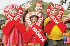  ?? — Reuters ?? People during an HIV/AIDS awareness campaign on the eve of World Aids Day in Kolkata, India, in this file photo.