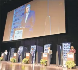  ?? STEVE HELBER/AP ?? Democratic gubernator­ial candidates, from left, Virginia state Sen. Jennifer McClellan, D-Richmond; former Gov. Terry McAuliffe; Lt. Gov. Justin Fairfax; Del. Lee Carter, D-Manassas; and former Del. Jennifer Carroll Foy participat­e in the final primary debate Tuesday at Christophe­r Newport University. The primary is next Tuesday.