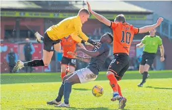  ??  ?? Kieran Wright and Mouhamed Niang collide before Nicky Clark scores the winner.