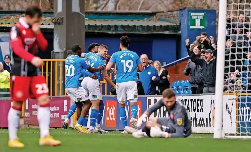  ?? Www.mphotograp­hic.co.uk ?? ●●Goalscorer Will Collar and team-mates celebrate going 1-0 up against Stevenage at the weekend