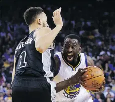  ?? MARCIO JOSE SANCHEZ/ THE ASSOCIATED PRESS ?? Golden State forward Draymond Green drives against San Antonio’s Kyle Anderson. The Warriors need to win their final three games to set a new season record for wins.