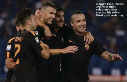  ??  ?? Roma's Edin Dzeko, 3rd from right, celebrates after scoring his side's third goal yesterday