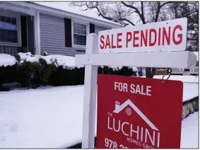  ?? (AP/Charles Krupa) ?? A sale pending sign is posted Monday outside a house in in Salem, N.H.