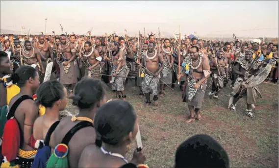  ?? Photos: Siphiwe Sibeko/Reuters ?? Subjected: King Mswati III (above) dances in front of maidens in the Reed Dance, but will he be able to orchestrat­e change for the better in the regional body? And does he have Zimbabwe’s President Robert Mugabe’s ear (left) on being democratic?