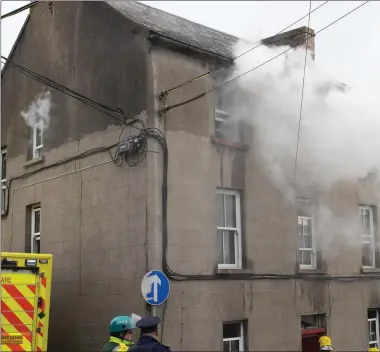  ??  ?? Emergency services surveying the scene at Mary Street.