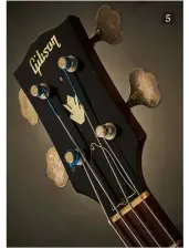  ??  ?? 5
Gibson’s EB-2 was introduced at Chicago’s NAMM show in July 1958 and was briefly discontinu­ed in ’61, before being reintroduc­ed in ’64; it was finally discontinu­ed in the early 70s. This example is from 1966
This EB-2 headstock shows a pearl logo and crown inlays, nickel-plated tuners, a laminated plastic ‘bell’ truss rod cover, and a black nitrocellu­lose finish over a holly veneer
Appearing as early as 1960, the EB-2’s bridge mute mechanism didn’t prove to be a highly popular addition and was often rendered unusable as the rubber contact material perished