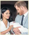  ??  ?? TENDER MOMENT Meghan and Harry with newborn Archie