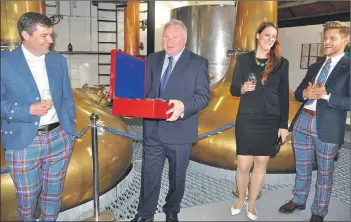  ?? Photos: Hugh Boag ?? Master distiller James MacTaggart is named head of the White Stag community.