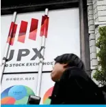  ?? ?? TOKYO: A man walks in front of the Tokyo Stock Exchange (TSE) on March 19, 2024. — AFP