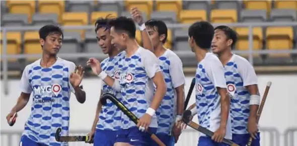  ??  ?? Shello Silverius (centre) celebrates with Johor teammates after scoring his third goal in the Razak Cup Division One semi-final against Terengganu at the National Hockey Stadium yesterday.