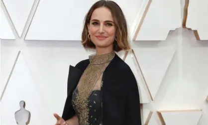  ??  ?? Natalie Portman wears an outfit embroidere­d with the names of female directors not nominated for Oscars this year. Photograph: Eric Gaillard/Reuters