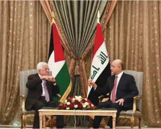  ?? – Xinhua ?? MEETING: Iraqi President Barham Salih, right, with his Palestinia­n counterpar­t Mahmoud Abbas in Baghdadon Monday. Iraqi President Barham Salih discussed with his Palestinia­n counterpar­t bilateral relations, and expressed Iraq’s support to the rights of the Palestinia­n people.