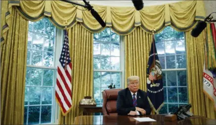  ?? EVAN VUCCI — THE ASSOCIATED PRESS ?? In this photo, President Donald Trump listens during a phone call with Mexican President Enrique Pena Nieto about a trade agreement between the United States and Mexico, in the Oval Office of the White House. Trump is making trade policy the connective tissue that ties together his “America First” foreign policy and his political strategy for the 2020presid­ential election.