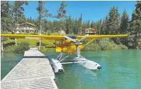  ?? GREG OLSEN ?? You can have a float plane pick you up right at the docks at Southern Lakes Resort in Tagish, Yukon.