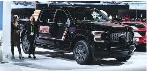  ?? FREDERIC J. BROWN/AFP/GETTY IMAGES ?? Motor Trend magazine’s 2018 Truck of the Year was the Ford F-150 Lariat Truck. Ford is planning to enhance its vehicles including the F-150 pickup line to boost its market share.