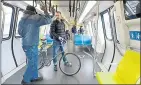  ?? DAN HONDA — STAFF ARCHIVES ?? Frank Bonanni, of Richmond, finds plenty of room for himself and his bike aboard a new BART train in Oakland in January.