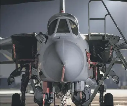  ??  ?? 0 An RAF Tornado, which was used in the airstrikes on Syria, back in the hangar at RAF Akrotiri in Cyprus