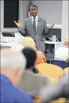  ?? BEN GRAY / BGRAY@AJC.COM ?? Interim DeKalb CEO Lee May answers questions at a community meeting in Brookhaven on Thursday. This was the last of eight meetings May held throughout the county after the release of a report on corruption in the county.