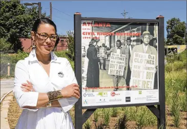  ?? ALYSSA POINTER / ALYSSA.POINTER@AJC.COM ?? Photos by Karcheik Sims-Alvarado are displayed in a 4-mile exhibit on the Atlanta Beltline based on her book, “Atlanta and the Civil Rights Movement 1944-1968,” in 2018.