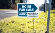  ?? KASSI JACKSON/HARTFORD COURANT ?? A “home for sale” sign is seen along Kingsbridg­e in Avon on Nov. 18.