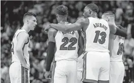  ?? AL DIAZ adiaz@miamiheral­d.com ?? Heat guard Tyler Herro, left, forward Jimmy Butler, center Bam Adebayo and forward Caleb Martin are some of the top players returning to the Heat this year.