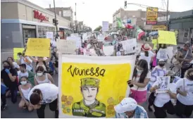  ?? TYLER LARIVIERE/SUN-TIMES ?? Hundreds of people march though Little Village on Friday, demanding justice for Army Specialist Vanessa Guillén.