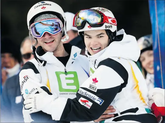 ?? — GETTY IMAGES ?? Philippe Marquis of Canada, left, celebrates with teammate Mikael Kingsbury after topping the podium in the dual men’s moguls freestyle world championsh­ip Monday in Kreischber­g, Austria. It was the first medal sweep by one country since 1999.