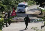  ?? THE ASSOCIATED PRESS ?? An ambulance with flashing lights leaves the cave rescue area in Mae Sai, Chiang Rai province, northern Thailand, Monday.