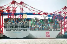  ?? AP-Yonhap ?? A container vessel is anchored at the Jade Weserport container terminal in Wilhelmsha­ven, Germany, Nov. 15.