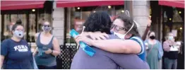  ??  ?? LEFT: Mugsie Palmer Pike hugs her friend Sam Sandmal on North Sheridan Road in the Rogers Park neighborho­od.