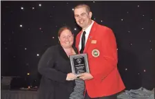  ??  ?? Accepting Chapter President Award: Carla McMorris- GCYF president, Blake Haley- GYFA president.