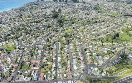  ?? PHOTO: STEPHEN JAQUIERY ?? Seesaw . . . Prices are up and sales down around Dunedin. Pictured: the suburb of Corstorphi­ne, looking towards St Clair Park and St Clair Beach, this week.