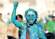  ?? MOHAMMED HUWAIS/ GETTY IMAGES ?? A man covered with green paint chants slogans as he attends a rally in Sanaa, Yemen, on the Prophet Muhammed’s birthday on Thursday.