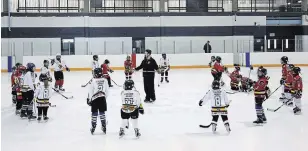  ?? JEFF MCINTOSH THE CANADIAN PRESS FILE PHOTO ?? Minor hockey associatio­ns across Canada have had to cut their seasons due to the COVID-19 pandemic, and many of them are trying to determine when they will resume and how.