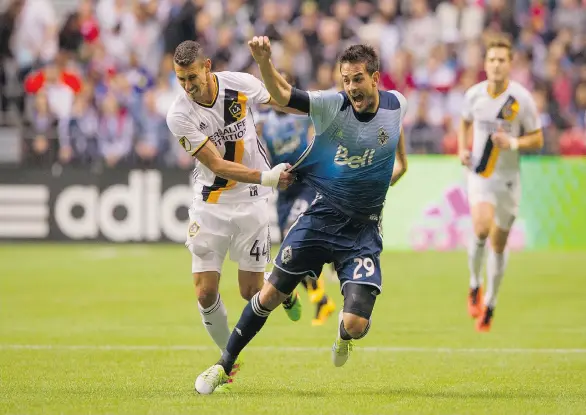  ?? RICHARD LAM/PNG ?? Vancouver Whitecaps Octavio Rivero reacts after getting pulled down by L.A. Galaxy Daniel Steres during MLS soccer action Saturday at B.C. Place Stadium in Vancouver.