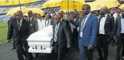  ??  ?? SLOW MARCH: Zweli Mkhize and Sihle Zikalala lead the pallbearer­s at the funeral of gospel singer S’fiso Ncwane yesterday
