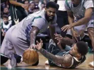  ?? CHARLES KRUPA — THE ASSOCIATED PRESS ?? Milwaukee Bucks forward Michael Beasley, right, battles for a loose ball with Boston Celtics forward Amir Johnson (90) during the second half of an NBA basketball game in Boston, Wednesday.