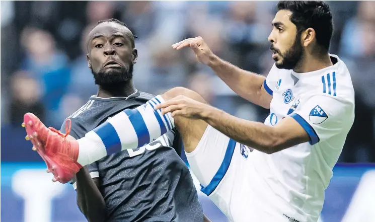  ?? — THE CANADIAN PRESS FILES ?? Vancouver’s Kei Kamara, left, and Montreal’s Victor Cabrera collide in Vancouver on March 4. Kamara is out injured for a few weeks, the team says.